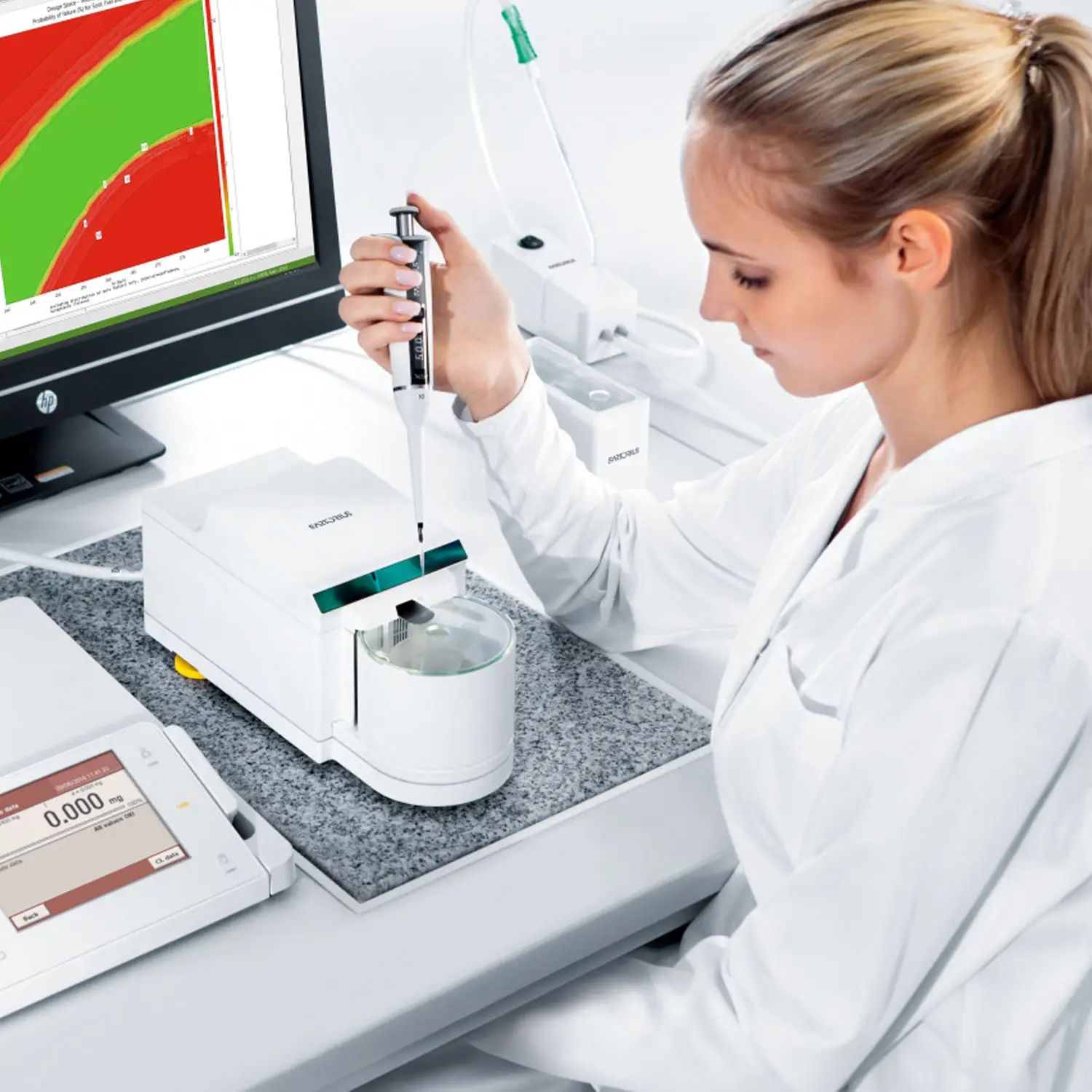 A technician calibrating a pipette